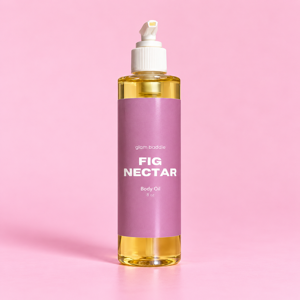 Glam Baddie Fig Nectar Body oil 8 oz bottle with purple label on a pink background.